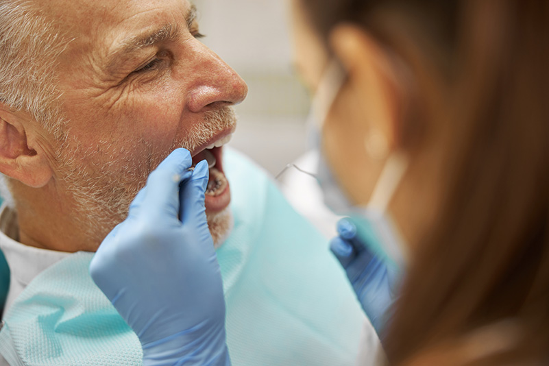 Senior man having a dental examination at a clinic