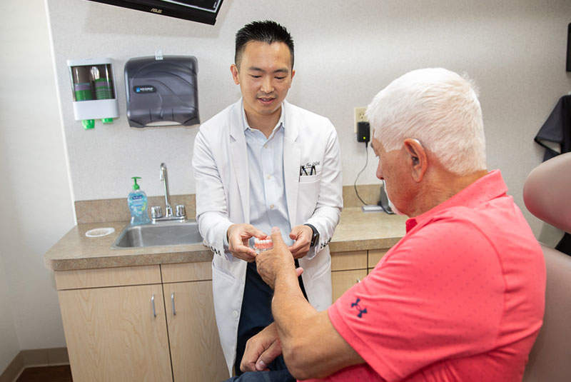 dr. hua showing. patient full arch implants