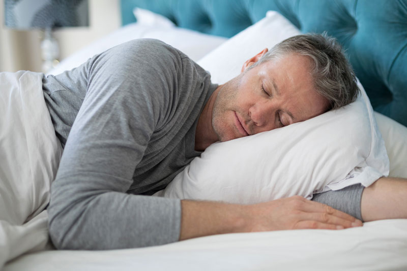 man sleeping after sleep-apnea-treaatment