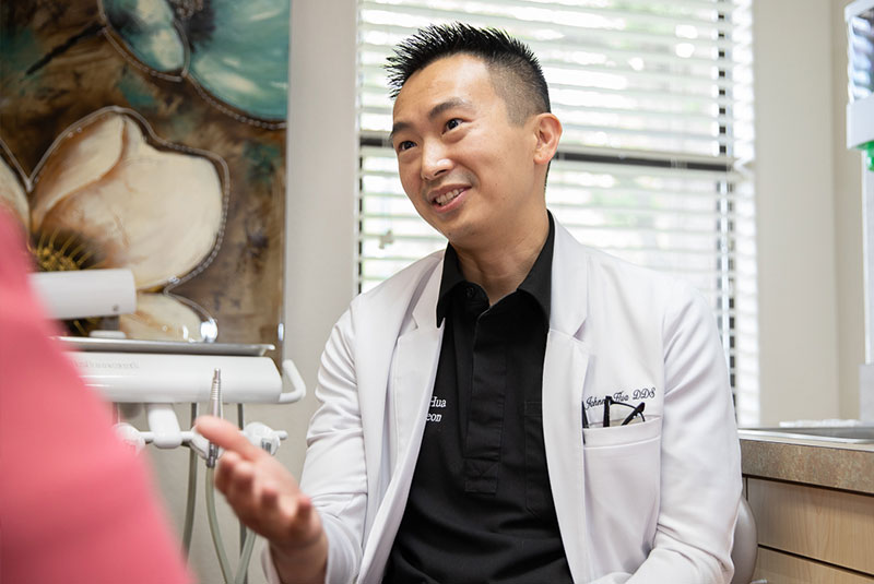 dr. hua smiling at patient