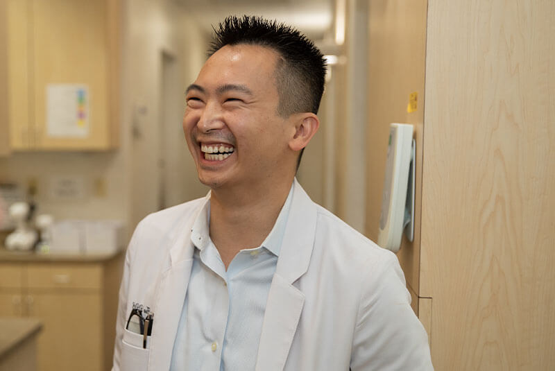dr. hua smiling and laughing