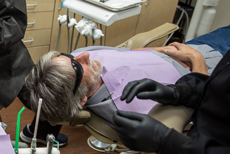 dental implant patient in exam chair preparing for surgical procedure